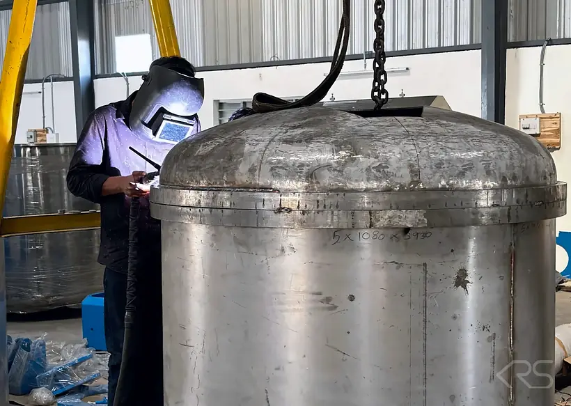 KRS DISPERMAHLTECHNIK welder fabricating a stainless steel process vessel in the KRS workshop